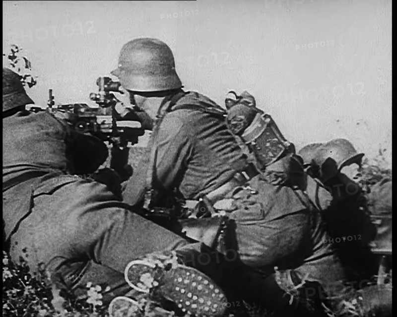 German Soldiers Firing from Cover at Dunkirk, 1940. Creator: British Pathe Ltd.