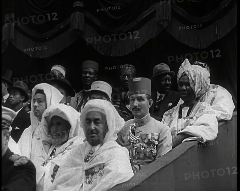 Dignitaries and Representatives from Various African Countries Sitting in Raked Seats at a..., 1939. Creator: British Pathe Ltd.