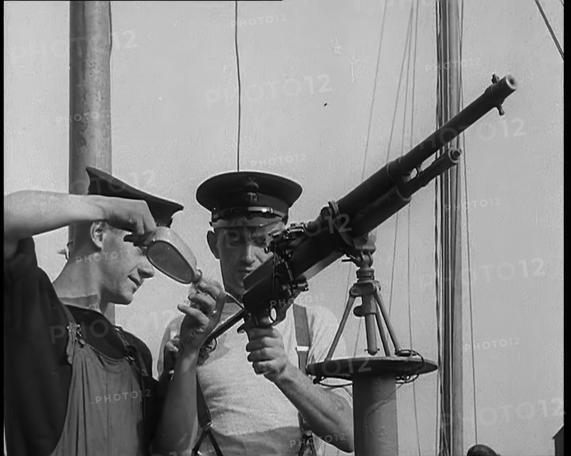 British Sailors Mounting Machine Guns To Small Boats for the Dunkirk Evacuation, 1940. Creator: British Pathe Ltd.