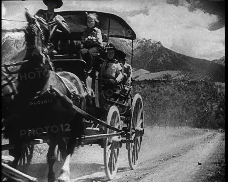 Coach and Horses Picking up Passengers Arriving Off the Train And Driving Through the Prairie, 1932. Creator: British Pathe Ltd.