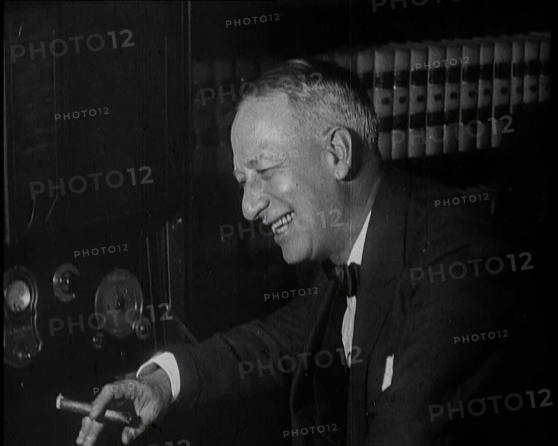 Al Smith, Former Presidential Candidate, Smoking a Cigar And Following Election Results..., 1932. Creator: British Pathe Ltd.