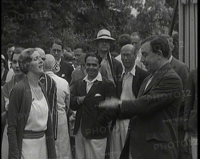 John Bonyton Priestley Tosses a Coin With Gladys Cooper, 1920s. Creator: British Pathe Ltd.