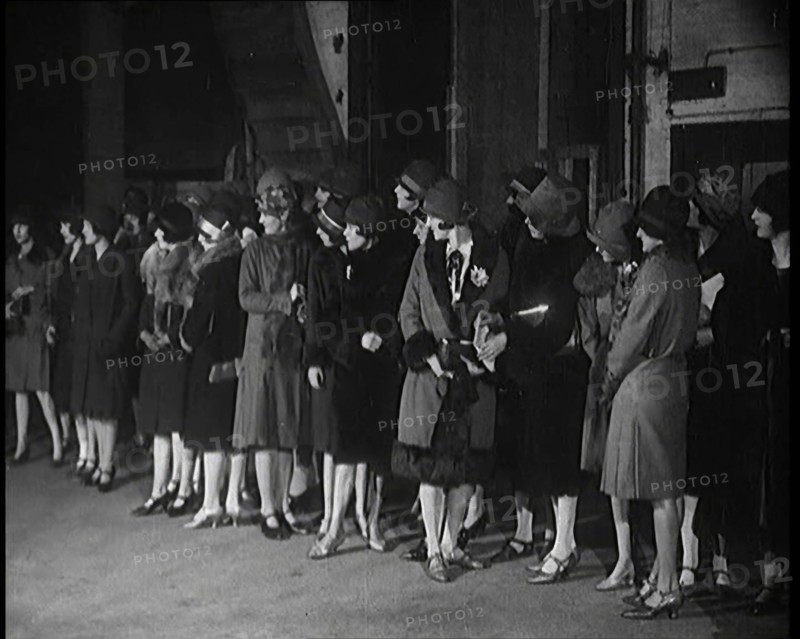 The Producer Julian Wylie Inspecting Young Prospective Female Stage Performers Standing..., 1920s. Creator: British Pathe Ltd.