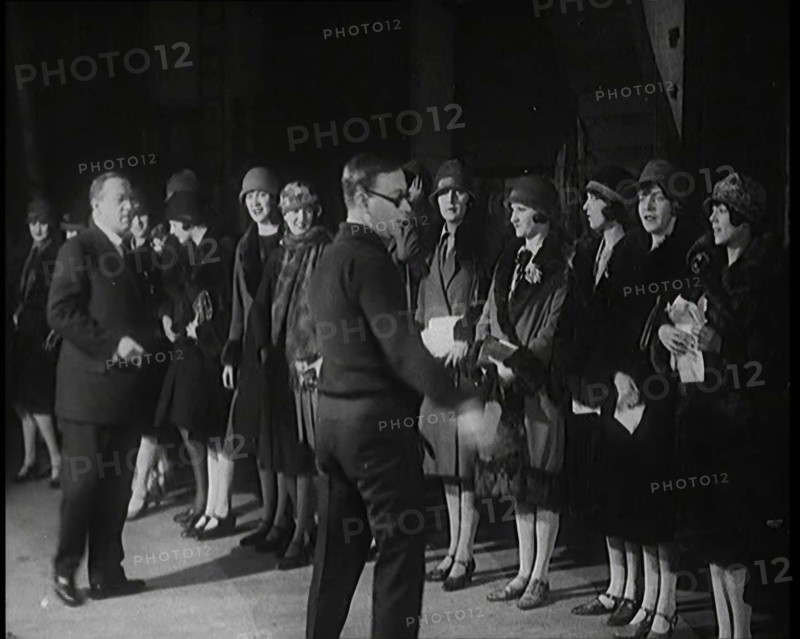 The Producer Julian Wylie Inspecting Young Prospective Female Stage Performers Standing..., 1920s. Creator: British Pathe Ltd.