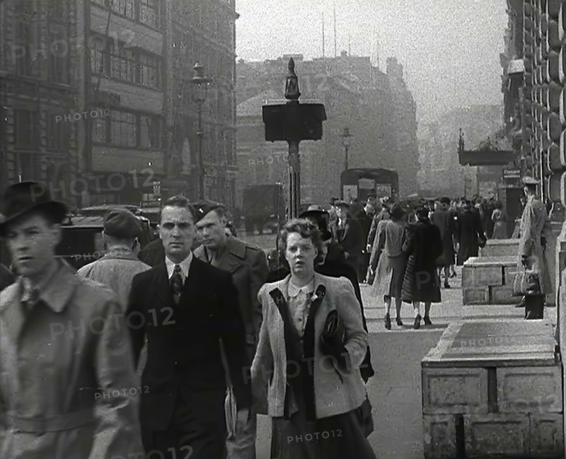 Civilians Walking Down a Street, 1942. Creator: British Pathe Ltd.