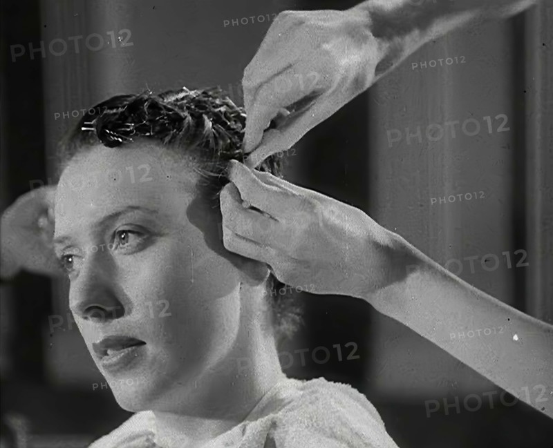 A Woman Having Her Hair Cut in the 'Victory' Style, 1942. Creator: British Pathe Ltd.