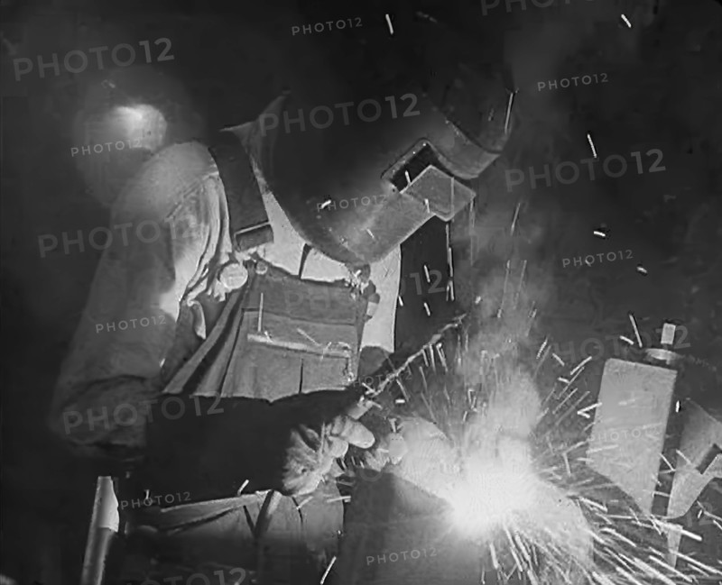 A Factory Worker Using a Blowtorch, 1943. Creator: British Pathe Ltd.
