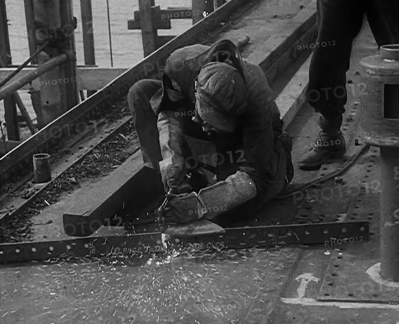 A Factory Worker Constructing Part of a Ship, 1943. Creator: British Pathe Ltd.