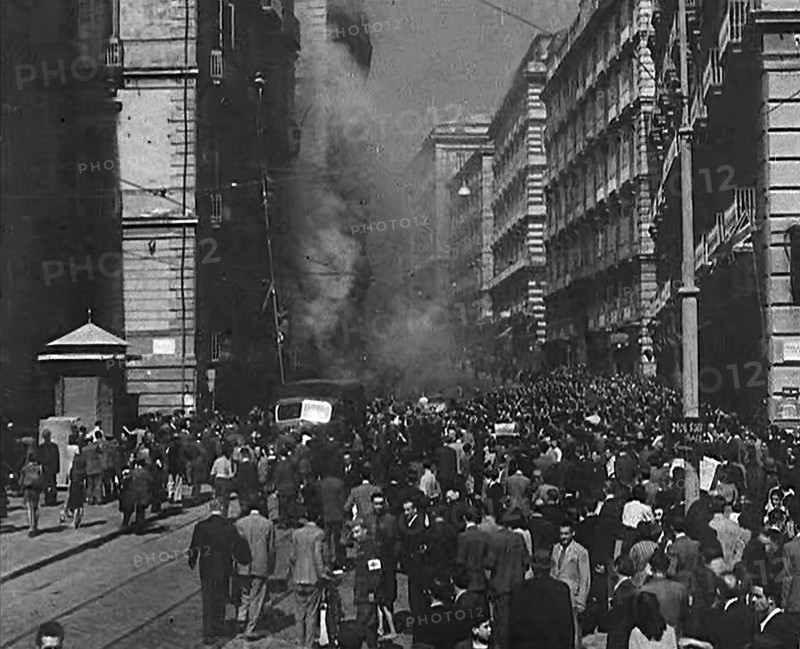 Italian Civilians Moving Slowly Through Bomb-Damaged Naples, 1943-1944. Creator: British Pathe Ltd.