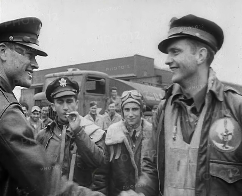 A Male Pilot Shaking Hands with an Officer, whilst other Pilots are Looking On, 1943-1944. Creator: British Pathe Ltd.