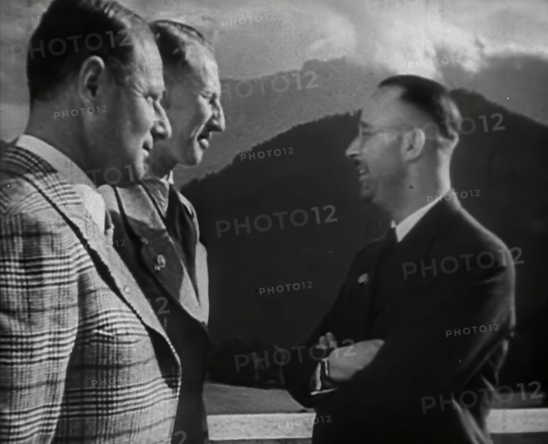 Heinrich Himmler Talking to Two Other Men, 1942. Creator: British Pathe Ltd.