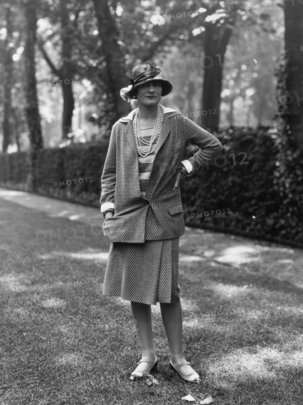 Coco Chanel modeling a Chanel suit on rue Faubourg Saint-Honoré in Paris, 1929, 1929. Creator: Sasha; (Alexander Stewart) (1892-1953).