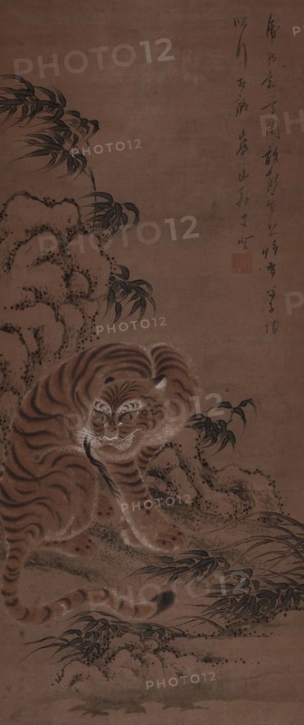 A tiger takes shelter under a rock, 1810. Creator: Kazan; Watanabe (1793-1841).