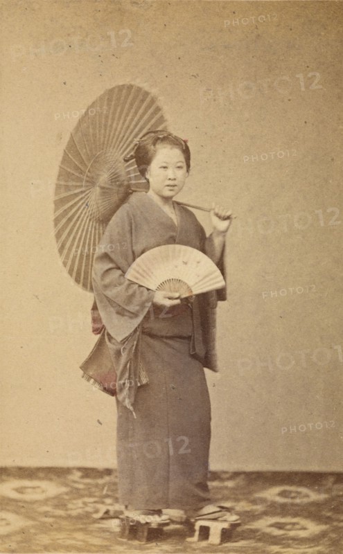 Woman with parasol and fan, about 1868. Creator: Felice Beato.
