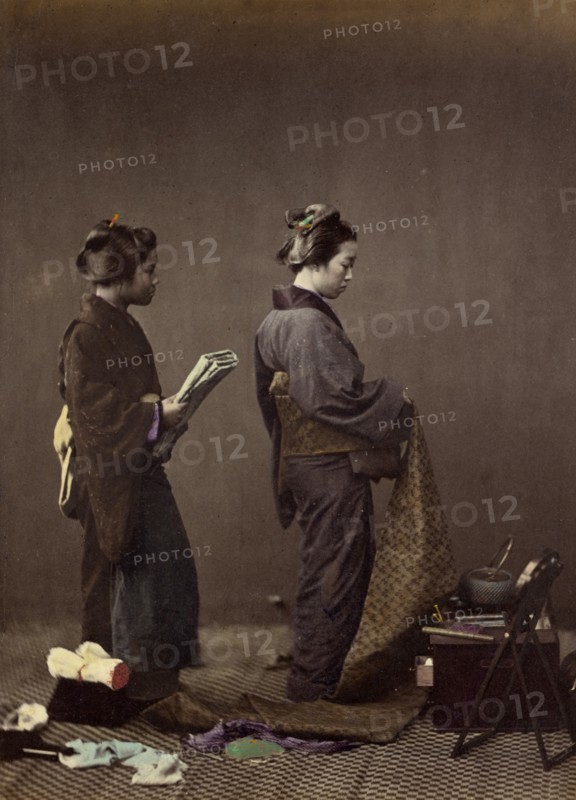 Putting on the Obi, or Girdle, 1866-1867. Creator: Felice Beato.