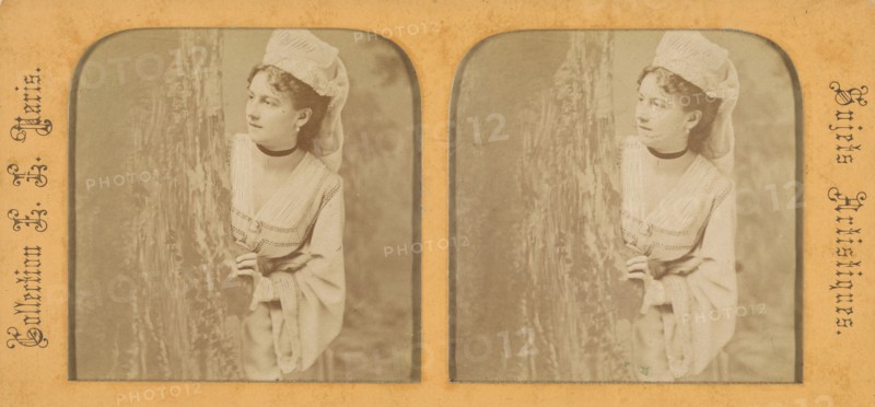 Woman in historical costume peering out around a tree, 1855-1865. Creator: Levy Fils & Cie.