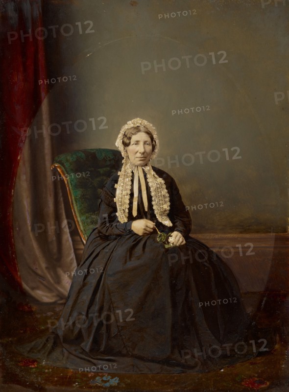Seated woman in bonnet, about 1850. Creator: Unknown.