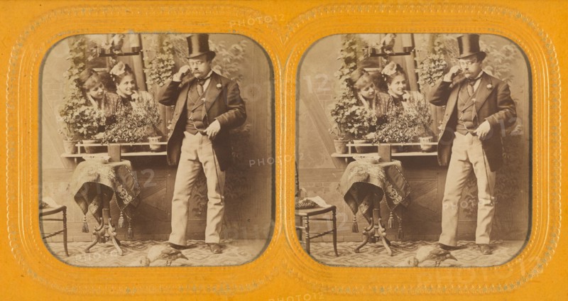Well-dressed man in top hat twirling his moustache, two women gazing at him through..., 1855-1860. Creator: Unknown.
