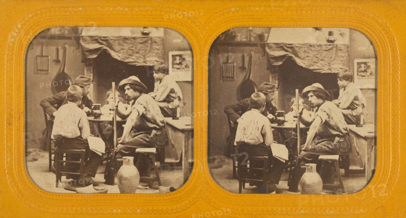 Men and boys at a table, one man holding a gun, 1855-1860. Creator: Unknown.