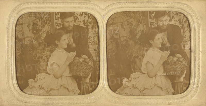 Unidentified couple: bearded man holding a single piece of fruit with a woman holding..., about 1865 Creator: Unknown.