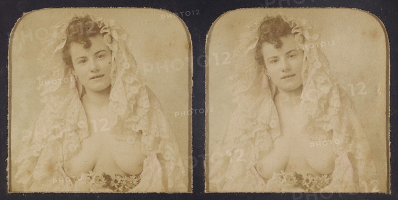 Woman wearing a lace mantilla with breasts exposed, 1855-1860. Creator: Unknown.