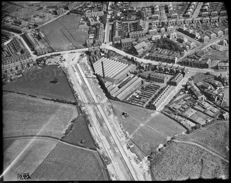 Hazelhurst Cotton Mill and the East Lancashire Road (A580)  under construction, Hazelhurst, c1930s. Creator: Arthur William Hobart.