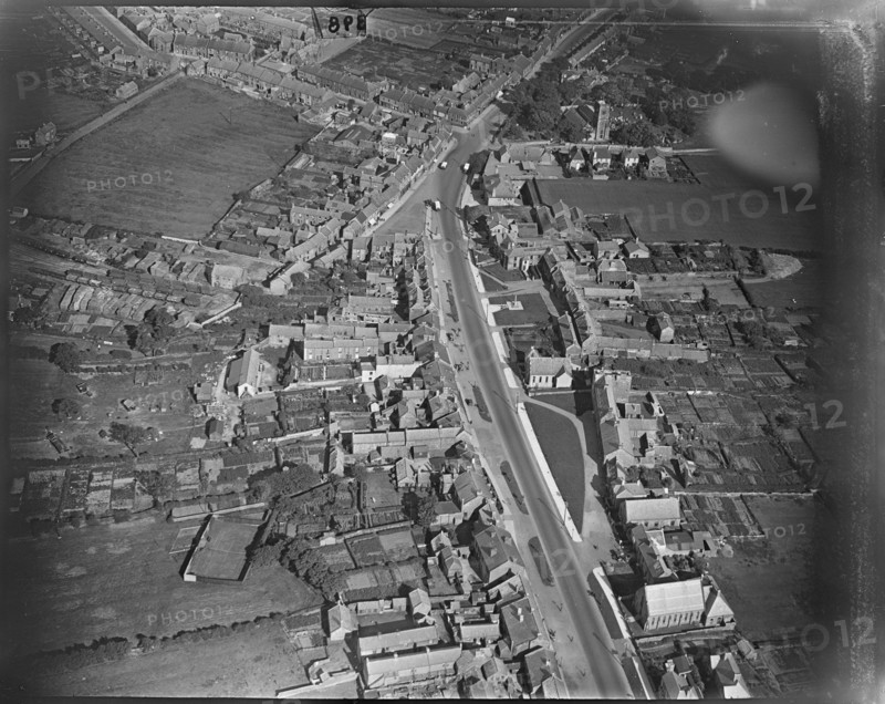 Front Street West and the Market Place, Bedlington, Northumberland, c1930s. Creator: Arthur William Hobart.
