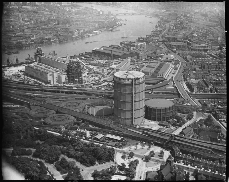 Battersea Power Station under construction and the Gas Holder Station, Nine Elms, London, c1930s. Creator: Arthur William Hobart.