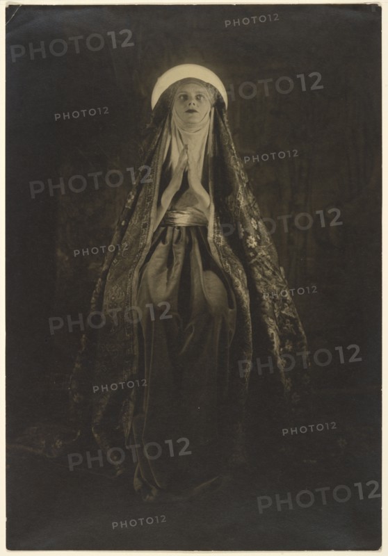 Portrait of a Woman Wearing a Long, Veiled Hat, about 1922. Creator: Francis Joseph Bruguiere.