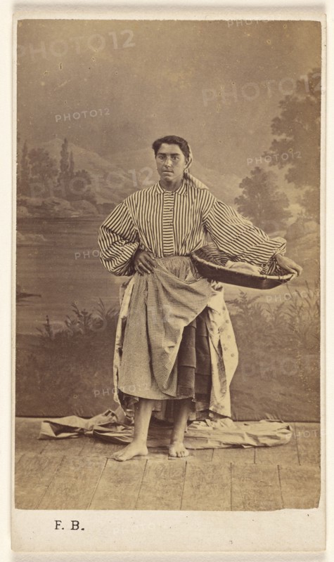 Genre portrait of an unidentified woman holding a basket, 1870-1875. Creator: Ferdinand Berillon.