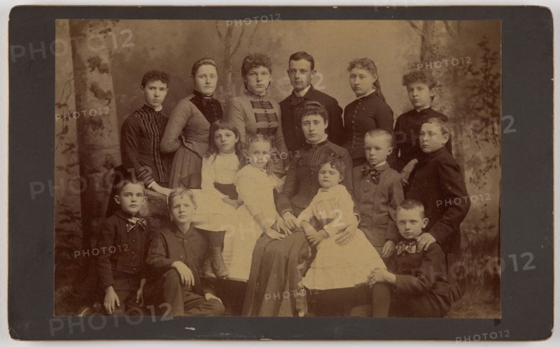 Group family portrait of fifteen people, 1870s. Creator: Unknown.
