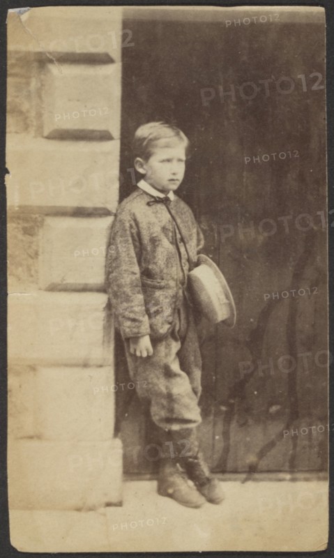 Portrait of a Young Boy in a Doorway, late 19th century. Creator: Unknown.