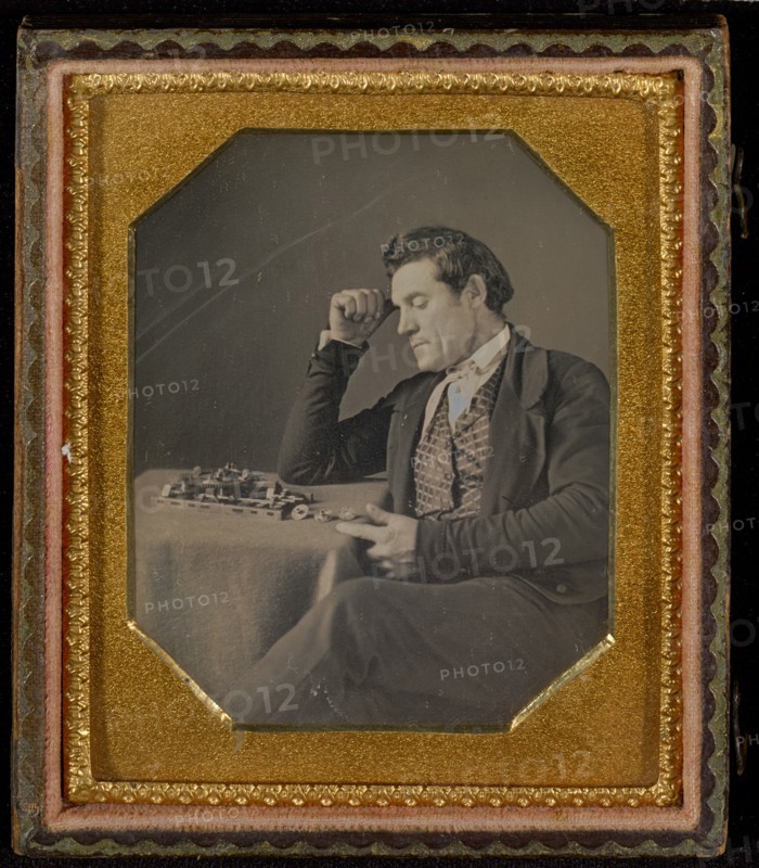 Man with a primitive calculating machine, about 1845. Creator: Unknown.
