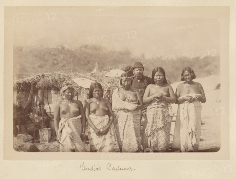 'A Group of Kadiweu Women with a White Man', 1884. Creator: Unknown.