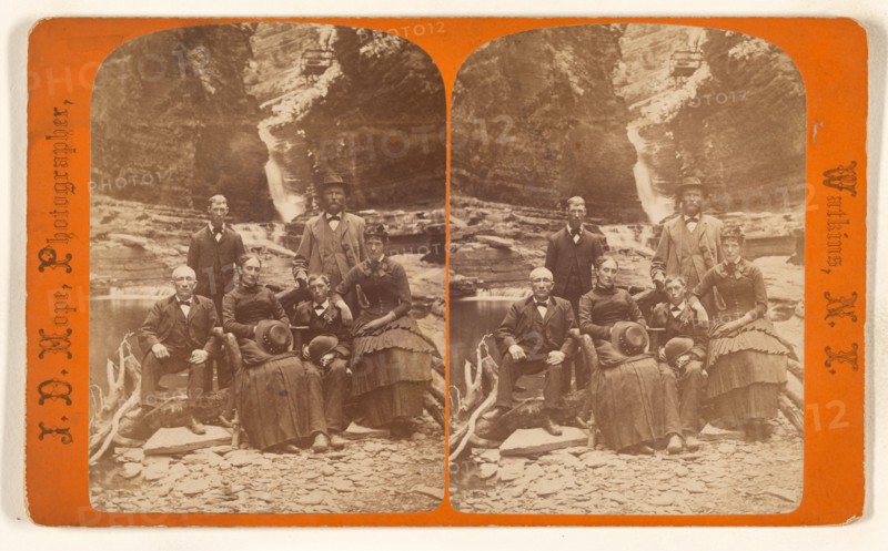 Family group portrait, posed in natural setting on rocks, 1868-1878. Creator: James Douglas Hope.