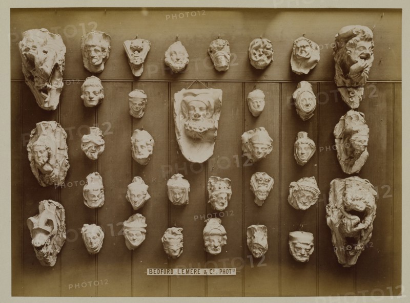 Casts of Gothic heads, possibly from York stalls, 1876. Creator: Bedford Lemere and Company.