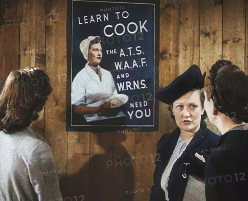An Information Film Showing Women Looking at a Recruitment Poster for Female Army Cooks, 1942. Creator: British Pathe Ltd.