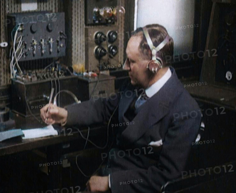 Italian Senator Guglielmo Marconi Using Radio Apparatus While Taking Notes, 1920. Creator: British Pathe Ltd.