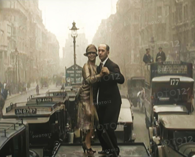 A Couple Dancing the Charleston on the Top of a Car Driving Down a London Street, 1926. Creator: British Pathe Ltd.