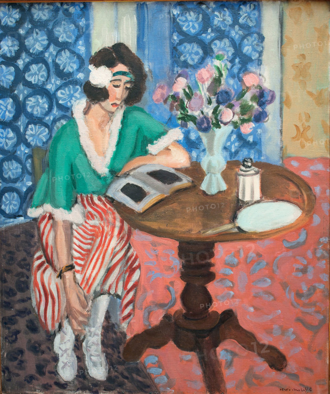 Reading woman at the table, 1921. Creator: Henri Matisse.