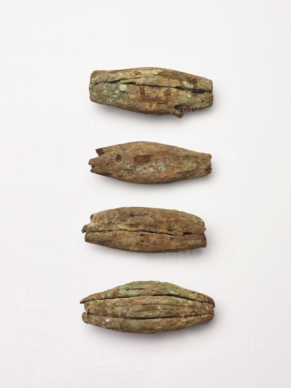 Four peg-like objects, perhaps imitations of canine teeth, 1200-1400. Creator: Unknown.
