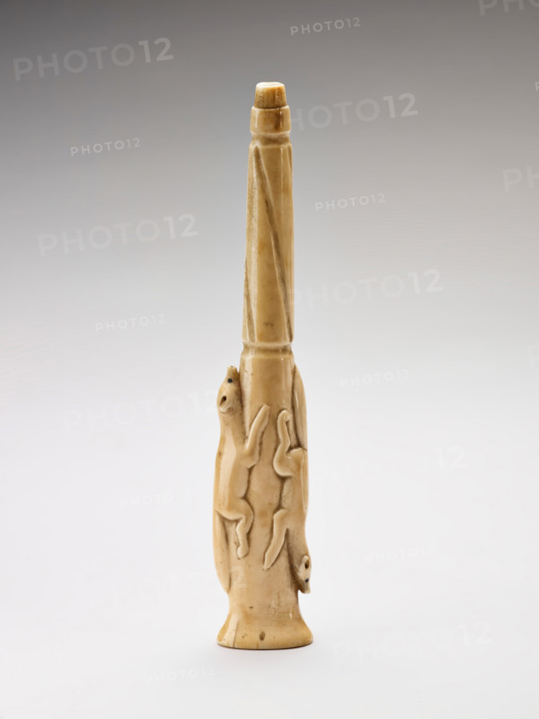 Carved harpoon foreshaft with two running foxes carved in relief, 1880-1920. Creator: Unknown.