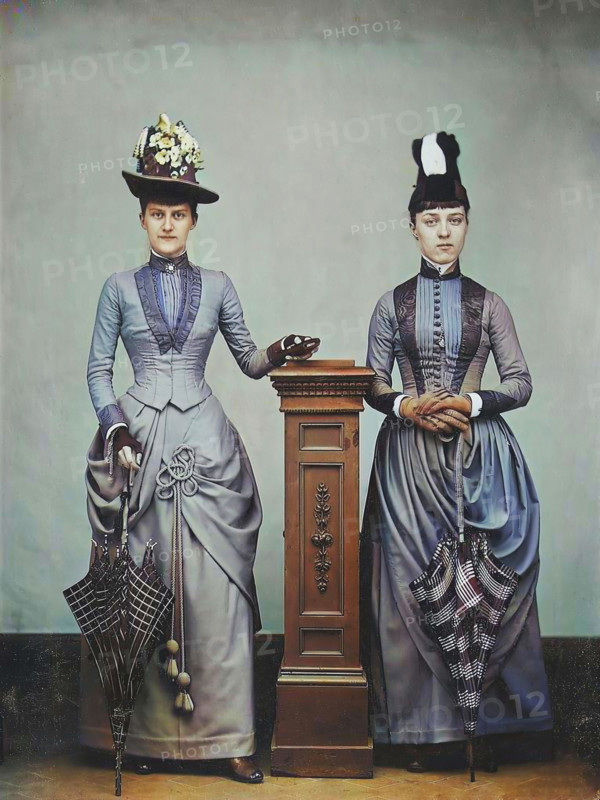Studio Portrait of Two Women Holding Folded Parasols, ca. 1885. Creator: Unknown.