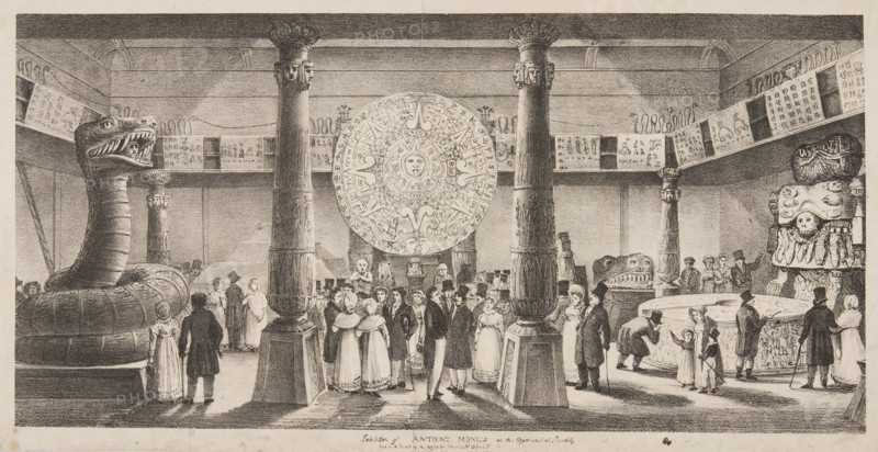 Exhibition of Antient [sic] Mexico at the Egyptian Hall, Piccadilly, London, c1824. Ancient Mexico was an exhibition by William Bullock of casts of Aztec artefacts and both copies and originals of Aztec codices. Objects exhibited included the "calendar stone" (described as "Montezuma's watch"), the statue of Coatlicue (called "Teoyamiqui"), the Stone of Tizoc, and an unidentified statue of a giant serpent. The collection apparently included 'specimens of fruits, plants and flowers, panoramic views of the country and models of dwellings, and other items which give an idea of the people, idols, and customs'. A Mexican man attended the room to describe the artefacts to the visitors.