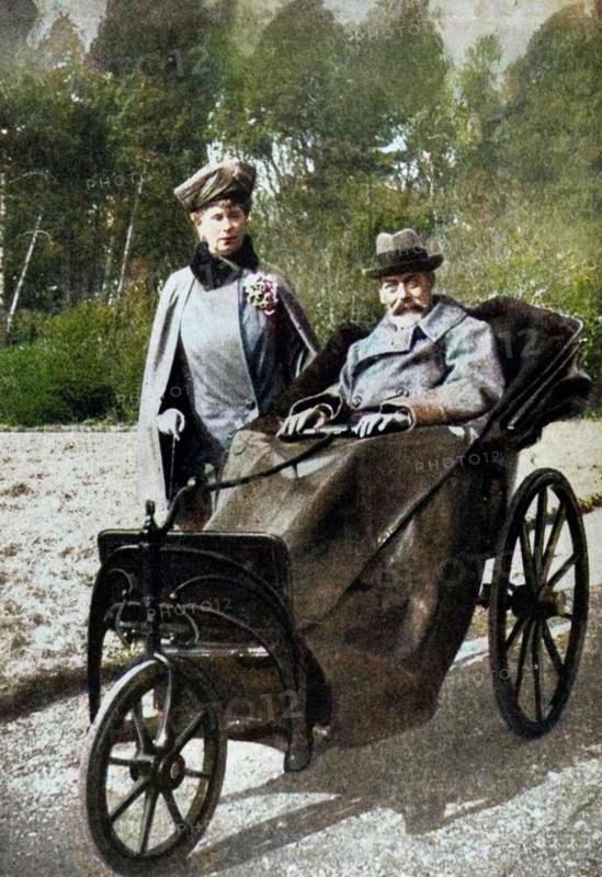 King George V (1865-1936) and Queen Mary (1867-1953) at Craigwell House, Aldwick, near Bognor Regis, c1930s (1936). George, the second son of Edward VII and Alexandra of Denmark, was born at Marlborough House on 3rd June, 1865. In 1893 he married Princess Mary (with whom he had six children) and in 1910, upon the death of his father, he became king. In 1924 he appointed Ramsay MacDonald, Britain's first Labour Prime Minister, and in 1932 he introduced the idea of broadcasting a Christmas message to the people. He died of influenza on 20th January, 1936 and was succeeded by his eldest son, Edward. From "His Majesty the King, 1910-1935", introduction by HW Wilson (Associated Newspapers Ltd, London, 1936). (Colorised black and white print).