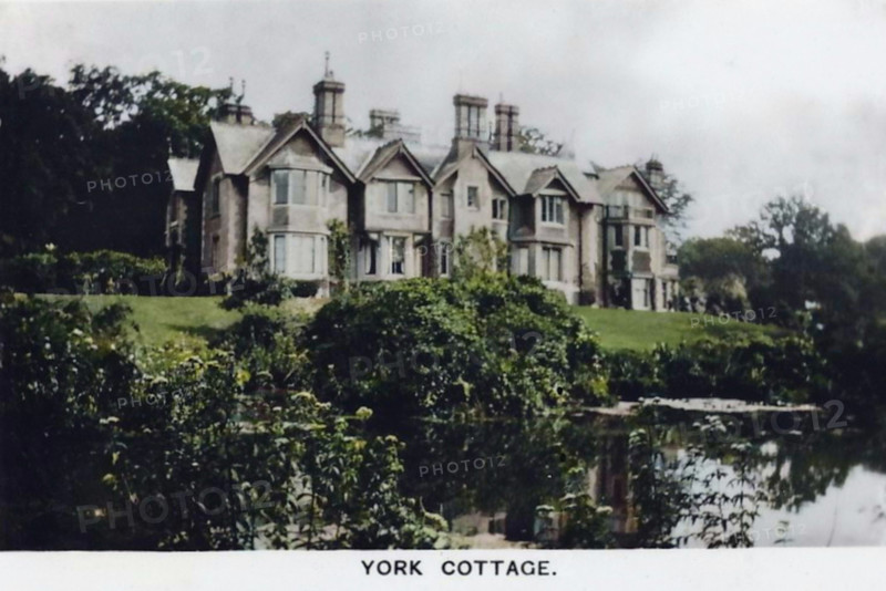 York Cottage, Sandringham, Norfolk, 1937. This was built by King Edward VII and was the birthplace of King George VI. Card No 47 of 48 from "Coronation Souvenir" cigarette cards produced for Tournament Cigarettes. [RJ Lea Ltd, Manchester, 1937]. (Colorised black and white print).