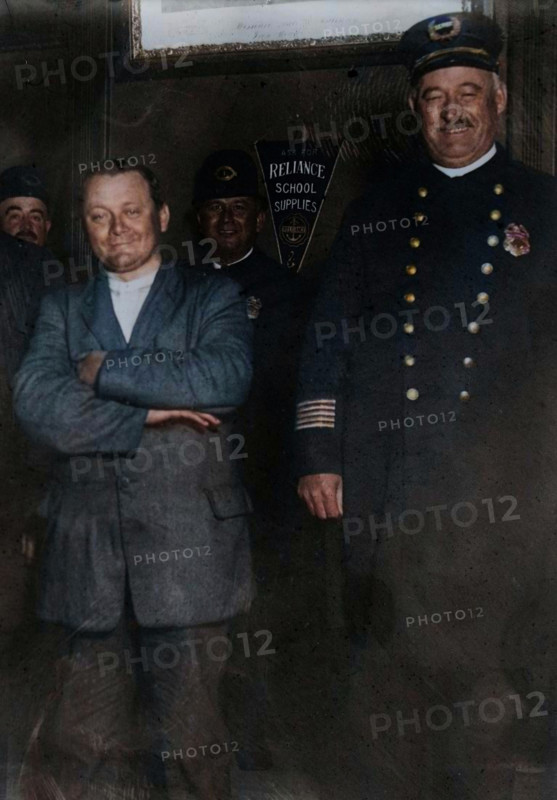 Schrank under arrest, 1912. John F. Schrank's attempted assassination of U.S. President Teddy Roosevelt in Oct. 1912. (Colorised black and white print).