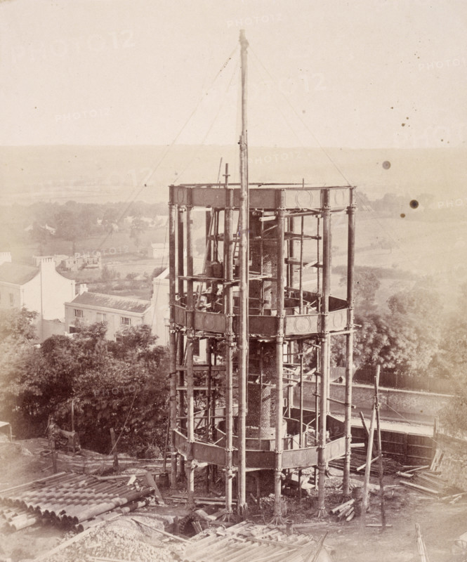 'The South Water Tower', Crystal Palace, Sydenham, 1852-1854. Designed by Sir Joseph Paxton to house the Great Exhibition of 1851 in Hyde Park, the Crystal Palace was reconstructed and enlarged in Sydenham in 1852. The first column was raised on 5 August 1852 and the palace was opened by Queen Victoria on 10 June 1854. Many exhibitions and events were subsequently held at the Crystal Palace until it burnt down on 30 November 1936. The park contained a motor racing circuit from 1937 until 1972 and the famous athletics track dates back to the foundation of the Crystal Palace Athletics Club in 1868. Plate 15 from "Photographic Views of the Progress of the Crystal Palace, Sydenham. Taken during the progress of the works, by desire of the directors, by Philip H Delamotte. Together with a list of the directors and officers of the company, etc". [London, 1855].