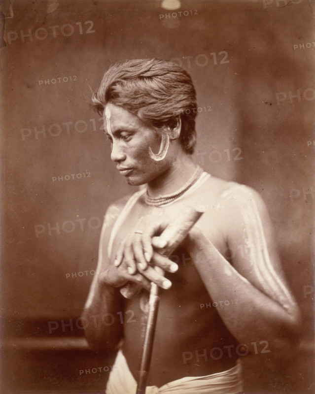 A Manipuri Polo player, 1860. This man from Manipur has face and body paint, and holds a polo stick. Manipur is an area in the far north-east of India, bordering Burma,