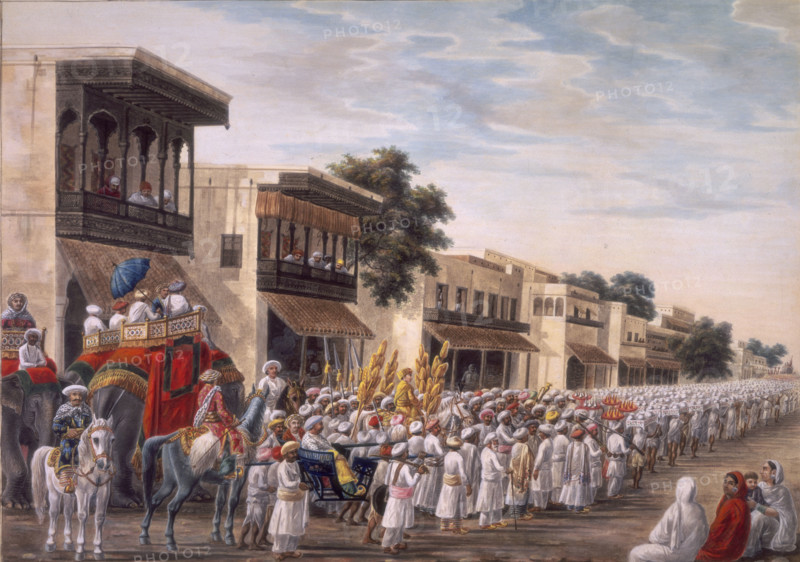 Marriage procession of a Muslim bridegroom proceeding to the bride's house, c1808. People ride on horseback, in howdahs on the backs of elephants, and by litter. The figure dressed in gold and surrounded by gold standards is the groom. Women watch at right, and men look down from carved wooden balconies. Inscribed on the back in English: 'Procession of the Sanhac'.